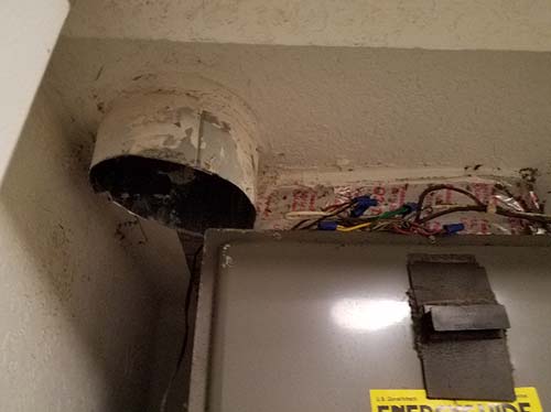 Photo of outdoor air duct stubbed into apartment AHU plenum closet. Not ideal but would be better to duct down to return air opening of AHU and provide volume damper for control.