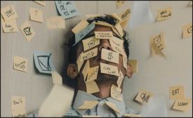 man covered with post its