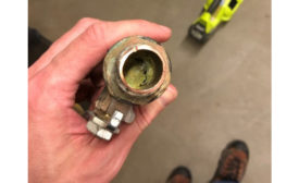 Excessive scale buildup on an isolation valve that had been partially closed for balancing purposes.